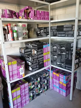 Shelves full of donated food boxes and sacks